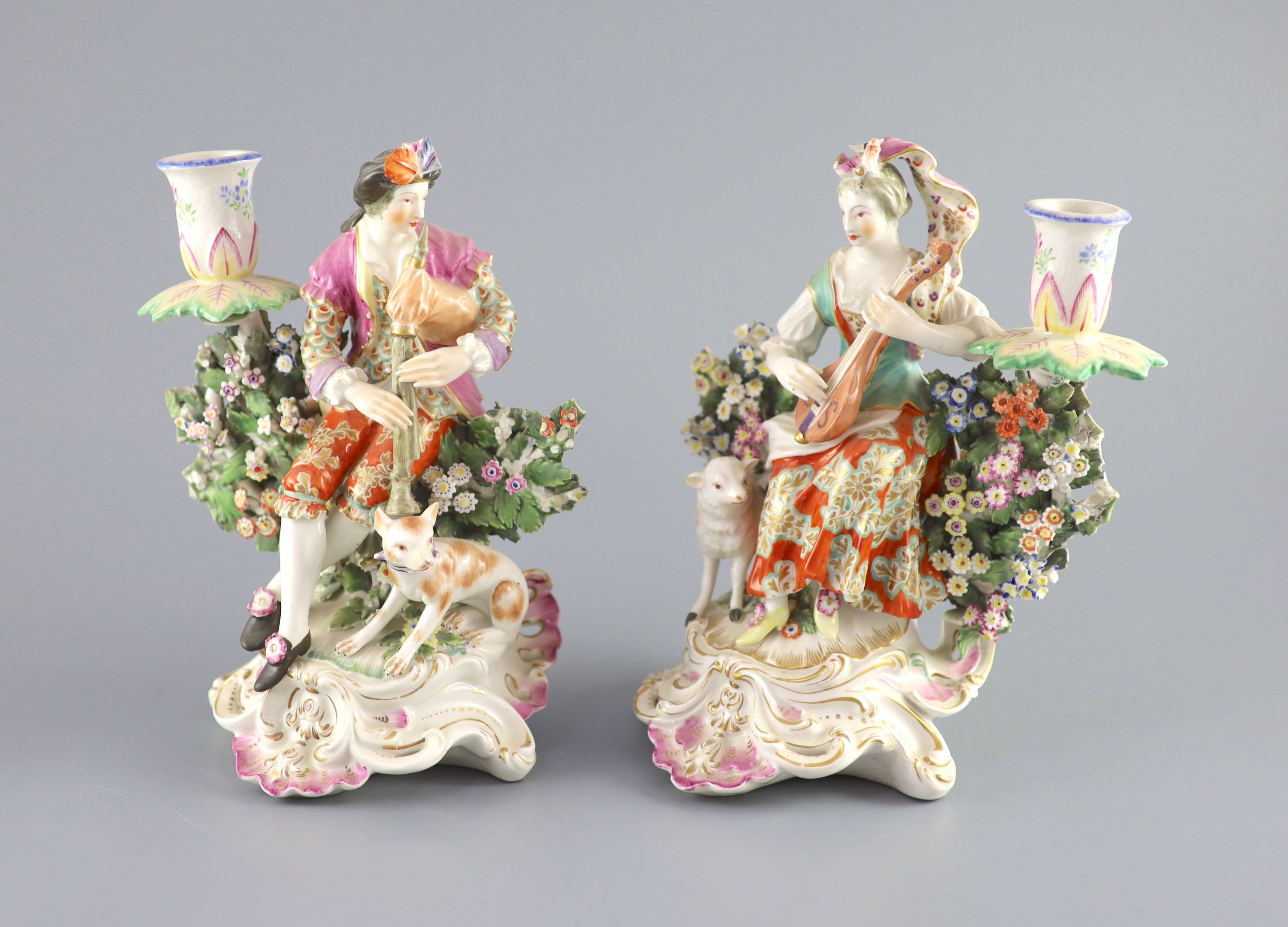 A pair of Chelsea Derby musician candlestick figures, c.1770, 22.5 cm high